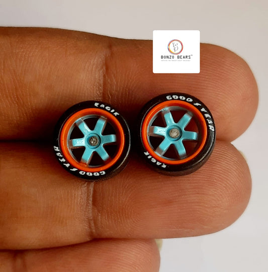 Rubber Tyre - 10mm Orange Rim Blue 6 spoke with Goodyear Eagle - 25mm axle Cv1