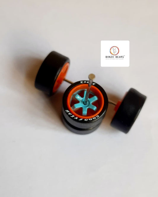 Rubber Tyre - 10mm Orange Rim Blue 6 spoke with Goodyear Eagle - 25mm axle Cv1