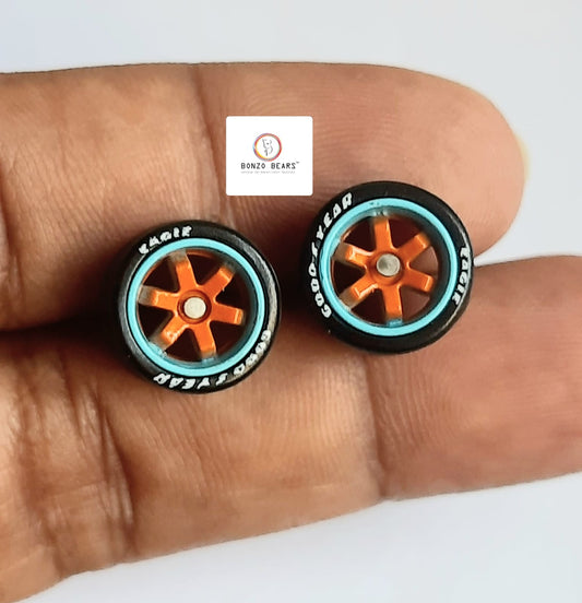 Rubber Tyre - 10mm Blue Rim Orange 6 spoke with Goodyear Eagle - 25mm axle Cv1